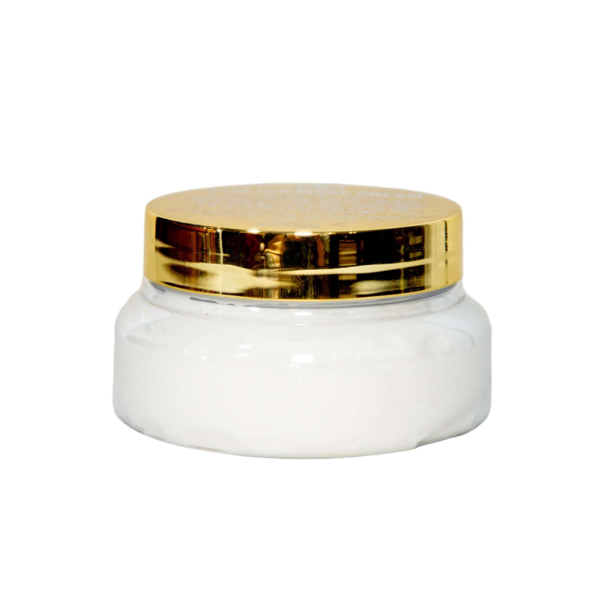 A small, clear glass jar with a gold lid gently holds the luxurious Diaz Beez Stretch Mark Cream infused with rosehip oil. The jar's simple elegance suggests a premium skincare product, beautifully set against a plain white background.