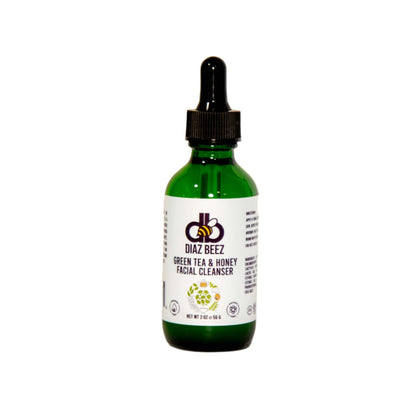 A green glass dropper bottle of Diaz Beez Green Tea & Honey Facial Cleanser against a plain white background. The label features the product name and a honeycomb logo at the top. The bottle size is indicated as 2 fl oz (60 ml).