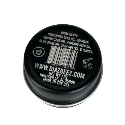Tattoo balm 1oz tin with ingredient list and website details on lid.