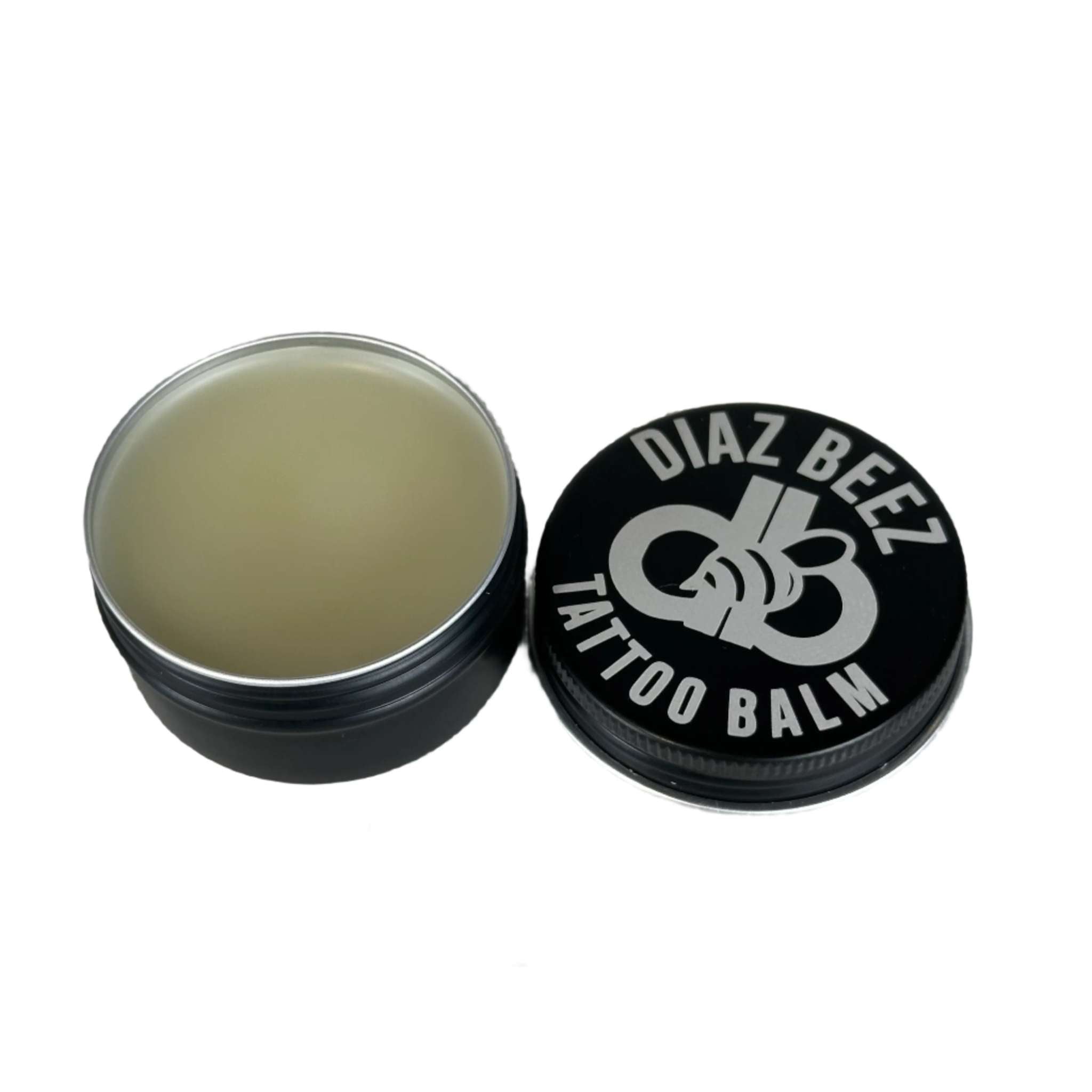 Tattoo All-Natural Balm tin with nourishing botanical oils for optimal tattoo care.