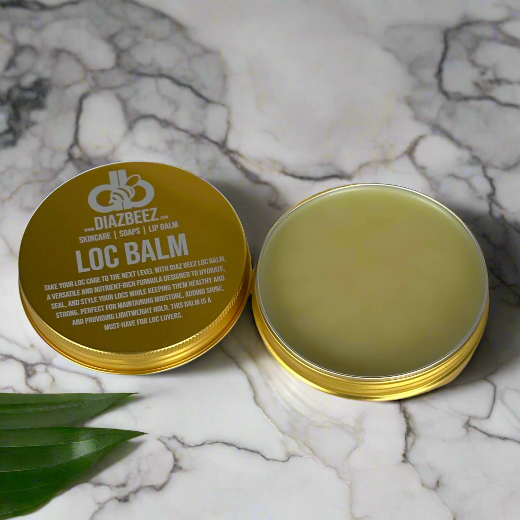 Diaz Beez Loc Balm tin on marble surface, natural hair styling product.